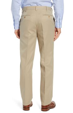 Classically tailored flat-front pants are crafted from smooth microfiber that resists water and stains to keep you looking sharp. 18" leg opening; 11 1/2" front rise; 17" back rise Zip fly with button-tab closure Side slant pockets; back button-welt pockets Water and stain resistant 100% polyester Dry clean Imported Fitted Full Length Chinos For Business Casual, Formal Full-length Chinos For Spring, Elegant Full-length Chinos For Spring, Elegant Full Length Chinos For Spring, Spring Elegant Full-length Chinos, Solid Full Length Work Pants For Business Casual, Classic Fitted Straight Leg Bottoms, Solid Full-length Chinos For Work, Spring Business Casual Pants With Standard Cut Leg