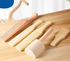 wooden kitchen utensils and spatulas on a table