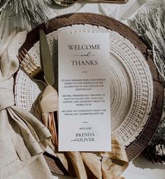 a table setting with place settings, silverware and napkins on top of it