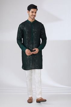 Dark green georgette kurta with all over sequin and thread embroidery. Paired with a white pant. - Aza Fashions Navratri Straight Kurta With Sequins, Navratri Sequined Straight Kurta, Designer Sequined Straight Kurta, Festive Straight Kurta With Sequins, Festive Sequins Straight Kurta, Festive Sequined Straight Kurta, Straight Kurta With Sequins For Navratri, Navratri Traditional Straight Kurta With Sequins, Traditional Sequined Straight Kurta For Navratri