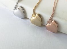 "Heart locket necklace, Locket necklace, gifts for her, birthday gift, dainty locket, heart necklace, rose gold necklace, gold locket, silver locket Delicate and mini heart shaped locket suspended on dainty 18\" cable chain *Heart locket pendant is approx 13mm, inside size is approx 9mm *Available in 3 finishes: Rose Gold Gold Rhodium SHIPPING: *Free domestic shipping on all orders PACKAGING: *All pieces come beautifully packaged, perfect for gift giving. Find more to ❤️ here: http://etsy.com/sh Dainty Rose Gold Heart Locket Necklace, Dainty Rose Gold Locket Necklace For Valentine's Day, Rose Gold Heart Pendant Locket Necklace, Rose Gold Heart Charm Locket Necklace Gift, Rose Gold Locket Necklace With Heart Charm As Gift, Locket Necklace For Her - Mother's Day Gift, Locket Necklace For Mother's Day Gift, Rose Gold Locket Necklace For Mother's Day, Dainty Rose Gold Locket Necklace For Anniversary