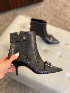 2-3/4" stiletto heel Pointed toe Functional inside zip Buckled strap at toe, zipper closure at outer ankle with long pull detail Leather upper; fabric lining; rubber sole Moto Dress, Dress Booties, Boutique Brands, Black 7, Style Gift, Black Booties, Stiletto Heel, Stiletto Heels, Rubber Sole