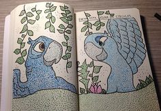 an open coloring book with two blue birds