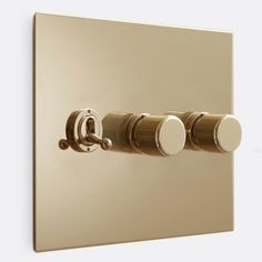 two round knobs on the side of a light switch