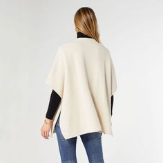 Looking for the perfect go-to cardigan? Look no further than the Collins Toggle Cardigan! This versatile one size cardigan boasts a chic toggle closure and handy front pockets, making it a must-have for any fashionista on the go. Materials: Acrylic/Polyester. Everyday Cream Knit Outerwear, Versatile Oversized Knit Outerwear, Versatile Everyday Sweater, Versatile Beige Knit Cardigan, Versatile Soft Knit Cardigan, Casual Cream Poncho For Fall, Chic Soft Knit Outerwear One Size, Chic One-size Soft Knit Outerwear, Casual Fall Cape For Workwear