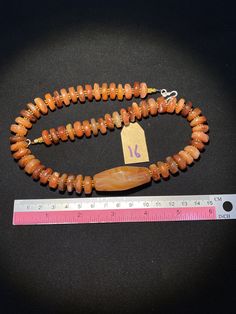 The orange color carnelian beads from my collections The origin of this beads from Nepal Himalaya although the carnelian agate can be found in Tibet Pakistan India Nepal and Afghanistan as well carnelian agate was used as prayers beads in mala and used as jewelry and amulet as well old agate and carnelian was used as trade items as well in ancient times The age of this beads are more than 600 years some gold color brass beads are used as spacers very smooth and shinny surface of this beads becau Round Carnelian Orange Beads, Round Orange Carnelian Beads, Orange Carnelian Beads For Spiritual Purposes, Spiritual Carnelian Amber Beads, Hand-strung Orange Agate Beads, Orange Carnelian Beads, Spiritual Orange Gemstone Beads, Healing Carnelian Orange Beads, Artisan Carnelian Beads In Amber Color