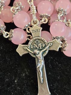 Beautiful handcrafted rosary.  These are made with 8mm baby pink glass  beads.  each bead is capped to add elegance and a nice finish.   The beads are smooth and very cool to the touch.   The centers and cross is from Italy and are high quality and very detailed.   I meticulously connect each bead with non tarnish Artistic Wire.  quality wire and quality beads. Pink Spiritual Rosary Bracelet With 8mm Beads, Pink 8mm Bead Spiritual Rosary Bracelet, Pink Beaded Spiritual Rosary Bracelet, Handmade Pink Rosary For First Communion, Pink 8mm Beads Rosary Bracelet, Pink Rosary With 8mm Beads For Gift, Pink Rosary With 8mm Beads As Gift, Pink Rosary With 8mm Round Beads, Pink Rosary With Round Beads For First Communion