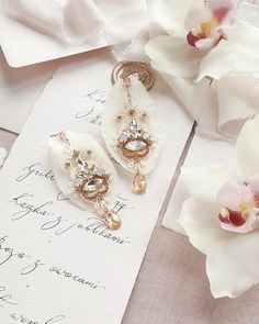 Orchid Bridal Earrings Crystal Gold Ivory and Blush Wedding - Etsy Poland White Crystal Embellished Bridal Earrings For Wedding, White Crystal Embellished Wedding Earrings, Elegant Handmade Crystal Wedding Earrings, Elegant Handmade Crystal Earrings For Wedding, Handmade Rose Gold Bridal Earrings For Wedding, Handmade Pink Crystal Earrings For Wedding, Gold Crystal Chandelier Earrings For Wedding, Gold Chandelier Earrings With Crystals For Wedding, Handmade White Crystal Earrings For Wedding