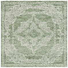 a green rug with an intricate design on the front and back side, in shades of white