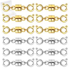 a set of gold and silver metal chain links with clasps on white background photo