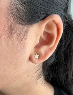 Enhance your celestial style with our stunning 14k Tiny Stud Star Earrings. Crafted from solid 14k real gold, these earrings showcase the beauty of delicate stars in a minimal design. Perfect for everyday wear or special occasions, these earrings make the best gift for someone special. Featuring three different sizes, the tiny 14k gold stars measure 4.30 mm, 5.30 mm, and 6.30 mm, adding a subtle variation to your look. The 14k yellow solid gold construction ensures lasting quality and a luxuriou Celestial Style, Celestial Design, Minimal Earrings, Tiny Star, Tiny Studs, Princess Cut Diamonds, Star Earrings, Gold Stars, Diamond Earrings Studs