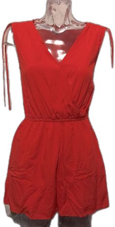 Red Beach Jumpsuit With Pockets, Red Jumpsuits And Rompers With Pockets For Beach, Red Beach Jumpsuits And Rompers With Pockets, Casual Red V-neck Jumpsuit, Red Cotton Jumpsuit For The Beach, Casual Red V-neck Jumpsuits And Rompers, Red Cotton Jumpsuits And Rompers For Beach, Red Cotton Beach Jumpsuits And Rompers, Chic Red Jumpsuits And Rompers For Summer