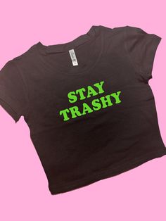 Stay Trashy SNUG FIT Crop Top | Cute Crop Top | Graphic Top | Gift For Her | Y2K Baby Tee | Y2K crop top | Gift for friend | Comfy Top to Lounge in! Actual item may be lighter/darker than pictured. M A T E R I A L S - SNUG FIT - 100% RING SPUN COTTON - Shoulder Taping S I Z I N G - Size chart is available on our listing photos. S H I P P I N G  &  P R O D U C T I O N  T I M E - Production Time is 5 Business Days. (May be delayed during the Holiday Season) - Shipping Time is 2-6 Business Days. (M Edgy Cropped Tops With Letter Print, Edgy Cotton Crop Top With Letter Print, Edgy Cropped Top With Letter Print, Stretch Slogan Crop Top For Streetwear, Edgy Stretch Crop Top With Letter Print, Grunge Cotton Crop Top With Letter Print, Green Letter Print Crop Top For Streetwear, Trendy Green Crop Top For Streetwear, Grunge Stretch Cotton Crop Top