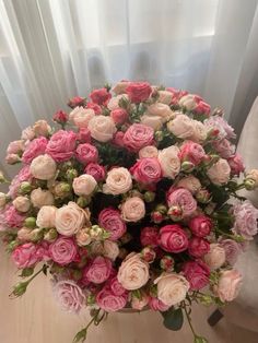 a large bouquet of pink and white roses