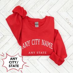 ◼️You can customize this shirt like: 👉🏻 ANY CITY NAME OR ANY WORD YOU WANT 👉🏻ANY STATE NAME OR PERSON NAME OR ANY WORD YOU WANT ◼️It is a Unisex Heavy Blen Crewneck Sweatshirt Gildan 18000 ● Made with a medium-heavy fabric blend of 50% cotton and 50% polyester (8.0 oz/yd² (271.25 g/m this sweatshirt feels cozy and is the perfect choice for those colder months. ● The classic fit along with the crew neckline deliver a comfy wearing experience with a clean-cut style. Meanwhile, the double-needl Casual Cotton Sweatshirt With Name Print, Casual T-shirt With Custom Text For College, Fall Casual T-shirt With Custom Text, Red Cotton Sweatshirt With Team Name, School Spirit Cotton Sweatshirt With Name Print, Cotton Sweatshirt With Name Print For School Spirit, Casual Custom Text T-shirt For College, Sporty Cotton Sweatshirt With Name Print, Sporty Crew Neck Sweatshirt With Custom Text