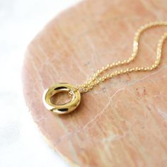 "Beautiful and lovely gold pendant necklace. Made of small gold circle pendant with skinny gold plated brass chain. Soft and warm. Great for gift, everyday or special occasion. Your item will ship in a gift box. Please feel free to contact me if you have any question. ♥ Length 15\" - 20\" ♥ Pendant 5/8\" ♥ Gold plated over brass ♥ See more Rudiana Accessories Rudiana.etsy.com" Simple Gold Necklace For Bridesmaid Gift, Gold Circle Charm Necklace For Gift, Gold Circle Minimalist Charm Necklace, Minimalist Circle Charm Gold Necklace, Minimalist Gold Circle Charm Necklace, Simple Gold Charm Necklaces For Bridesmaids, Gold Charm Necklace For Bridesmaid Gift, Simple Gold Charm Necklace For Bridesmaids, Minimalist Charm Necklace With Round Pendant For Birthday