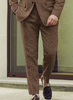 Unveil a legacy of style with our Harris Tweed Irish Brown Herringbone Suit, blending rugged charm with refined tailoring. Fashioned from pure wool, this suit features a herringbone weave that showcases a rich blend of earthy brown tones with intricate texture. The subtle pattern exudes timeless elegance, making it the perfect choice for any occasion. Whether you're attending a countryside wedding or stepping into a high-powered meeting, this suit ensures you stand out with confidence and class.  Look Includes    Harris Tweed Irish Brown Herringbone Fabric  Two Button Jacket Style  Notch Lapel   Horn   Brown  Buttons  Single Vent  Three Cuff Buttons  Two Welted Back Pockets on Trousers    Click 'Customize Now' to modify the look if needed.   Lining: Viscose, Dry Clean. Formal Tweed Jacket With Herringbone Pattern, Timeless Business Tweed Jacket With Herringbone Pattern, Timeless Tweed Jacket With Herringbone Pattern For Business, Classic Wool Suits With Herringbone Pattern, Wool Suits With Herringbone Pattern For Business Casual, Tailored Herringbone Pattern Suits, Brown Wool Suit With Herringbone Pattern, Tailored Wool Suit With Herringbone Pattern, Brown Tweed Suit With Herringbone Pattern