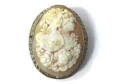 This unusual finely carved pendant and brooch are on sale for $1,296.00 reduced from $1,440.00. Item: Brooch/Pendant Circa: 1837 - 1901, probably The Romantic Period (1837-1860)  Cameo Material: Carnelian Shell Decorative Material: Natural Seed Pearls on border of tiny filigree hearts. Metal: 14 Kt Yellow Gold, Marked Size (Approximate): Oval Bezel 2.1875 inches long x 1.75 inch; Carnelian shell Cameo: 2.125 inches x 1.5 inches Weight: 21.93 grams Condition: Overall condition is excellent with n Collectible Art Deco Carved Jewelry, Art Deco Carved Collectible Jewelry, Luxury Engraved Brooch For Anniversary, Elegant Formal Brooch With Intaglio Detail, Antique Carved Brooches For Weddings, Elegant Intaglio Brooch For Formal Occasions, Elegant Intaglio Brooches For Gifts, Antique Medallion Brooch For Wedding, Elegant Medallion Brooch For Collectors