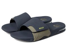 Reef Fanning Slide - Men's Shoes : Green Flash : With a synthetic upper, padded liner, compression molded footbed with a heel airbag, plus herringbone rubber outsole, the Reef Fanning Slide features a built-in bottle opener to celebrate success. Vamp strap for support and comfort. Contoured footbed. Heel airbag. Built in bottle opener. Synthetic upper and lining. Synthetic insole and outsole. Imported. Measurements: Weight: 8 oz Product measurements were taken using size 9, width D - Medium. Ple Blue Slides With Cushioned Footbed For Outdoor Activities, Navy Sporty Slides With Cushioned Footbed, Sporty Navy Slides With Cushioned Footbed, Sporty Slides With Textured Footbed For Outdoor Activities, Synthetic Slides With Gel Cushioning For Outdoor, Outdoor Slides With Gel Cushing, Synthetic, Functional Slides With Textured Footbed, Synthetic Slides With Textured Footbed For Outdoor Activities, Functional Synthetic Slides With Cushioned Footbed