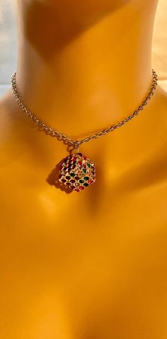 This " Rainbow cube" necklace is handmade. The necklace is made out of a metal cube with multicolored rime stones. We usually ship packages within 1-2 business days and you will receive an email notification when we ship your package. Depending on your location, our shipping time takes about 4-5 business days. Thank you for your support and have a wonderful day! :3 HAVE QUESTIONS? Please don't hesitate to reach out! 😊 Multicolor Jeweled Rhinestone Necklace Gift, Multicolor Jeweled Rhinestone Necklace For Gift, Costume Rhinestone Necklace For Gifts, Metal Rhinestone Pendant Necklace For Gift, Multicolor Square Jewelry Gift, Multicolor Square Jewelry For Gifts, Multicolor Clavicle Chain Choker As Gift, Gift Rhinestone Pendant Necklace, Rhinestone Choker Necklace As Gift