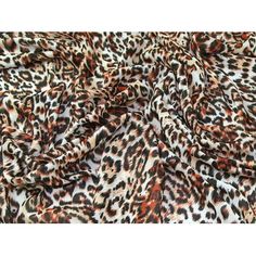 an animal print fabric with brown and black spots on the top, it is very soft