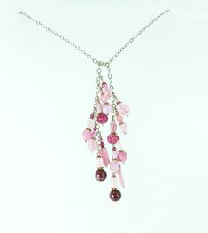 Vintage Czech glass beads in all shades of pinks and rose pair with modern Czech glass beads.  These beads are a mix of molded glass and handmade glass beads.  Each has its own details and together they are a great one of a kind necklace.  A touch of Swarovski crystal gives just the right amount of sparkle.  Each pink bead set dangles from sterling silver chain that can be worn looped high or low.  This necklace has no clasp.  Instead one end is looped over the other in a half knot or however yo Pink Glass Beaded Chain Jewelry, Pink Glass Jewelry With Beaded Chain, Pink Glass Jewelry For Jewelry Making, Handmade Pink Glass Jewelry, Pink Beaded Czech Glass Jewelry, Pink Czech Glass Jewelry For Party, Adjustable Pink Bohemian Lariat Necklace, Pink Bohemian Adjustable Lariat Necklace, Adjustable Bohemian Pink Lariat Necklace