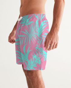 Men's Swimsuit, Tropical Foliage Pink and Teal Blue Pink and Teal Tropical Floral Leaf swim trunks. Bright turquoise blue and vibrant pink tropical foliage print Product Details Head to the beach in our classic fit Men's Swim Trunks made with comfort in mind. With an adjustable drawstring waistband, its smooth and durable materials made with UPF 50+ gives you premium UV protection. Soft, lightweight fabric Drawstring waistband UPF 50+ Built-in mesh brief Two side, one back slip pocket Printed, c Cheap Pink Short Swim Trunks, Pink Hibiscus Print Swimwear For Summer, Green Tropical Shorts, Tropical Swim Trunks With Tropical Print, Green Tropical Swim Trunks For Summer, Tropical Pink Swim Trunks For Beach, Tropical Swim Trunks For Summer, Tropical Swim Trunks For Beach Season, Green Hawaiian Swim Trunks For Swimming