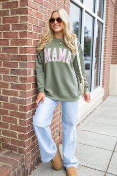 Details Green Oversized crewneck with mama design Relaxed fit, runs slightly oversized Crew neckline, long sleeves Size small from shoulder to hem: 26" Material and Care Pink Lily Exclusive Sweatshirt 57% Cotton/43% Polyester Hand wash cold, no drum drying Patterns may vary Materials may have natural variations Colors may vary from different viewing device PLEASE NOTE: You may notice some off-white residue or slight discoloration when you first receive your shirt. Please do not worry! This comes Sweatshirt With Leggings, Mama Design, Short Maxi Dress, Pink Activewear, Oversized Crewneck, Sweatshirt Fabric, Red Jumpsuit, Sweatshirts Pattern, Mama Sweatshirt