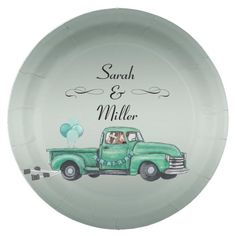 a green paper plate with an image of a truck and balloons