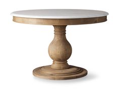 a round wooden table with white marble top