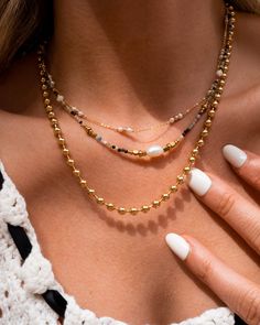 After all the love for our beaded bracelets, this necklace is the next addition to your collection. Featuring the same quality beads you've come to know and love, the Ezé necklace is perfect for someone who wants to dip their toes into the world of statement pieces. 14k Gold Vermeil Length: 17.5” Pearl Chain Necklace With Round Beads, Gemstone Beads Pearl Necklace, Multi-strand Beaded Chain Necklaces For Gift, Pearl Beaded Chain Necklace, Adjustable Chain Necklace With Round Tiny Beads, Adjustable Chain Necklace With Colorful Round Beads, Adjustable Beaded Chain Necklace With Round Beads, Everyday Pearl Jewelry With Tiny Beads, Colorful Multi-strand Pearl Necklace