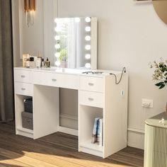 a white vanity with lights on it in a room