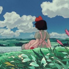 two anime characters sitting in the grass looking at each other and one is holding a flower