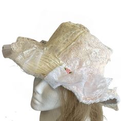 "Add a touch of vintage charm to your outdoor adventures with this upcycled vintage lace bucket hat for women. Perfect for the shabby chic cottage core bride or as a stylish honeymoon accessory, this hat also doubles as the ideal beach or sun hat. Stay cute and protected from the sun with this unique and versatile piece that is sure to turn heads wherever you go. Handcrafted with love and attention to detail, this hat is a must-have for anyone looking to add a touch of coquette nostalgia to their wardrobe. DESCRIPTION This shabby chic white bucket hat is covered in vintage and reclaimed lace in shades of true white, ecru and pale pink. Perfect for the coquette look, or a fun gift for any bride! The base bucket hat is new and added textiles are upcycled from scraps from other fabric project Bohemian Wide Brim Mini Hats For Garden Party, Vintage Mini Hats For Spring Festivals, Vintage Beige Hat For Festival, Vintage Beige Festival Hat, Spring Festival Vintage Mini Hats, Vintage Brimmed Mini Hats For Festivals, Bohemian Brimmed Mini Hats For Garden Party, Adjustable Vintage Mini Hats For Festivals, Vintage Adjustable Mini Hats For Festivals