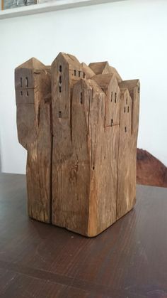 a wooden block sitting on top of a table