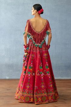 Red attached cancan lehenga with floral print and side pompom tassels. Paired with a fringed blouse with dangling cowrie shell details. - Aza Fashions Cape Lehenga, Lehenga And Blouse, Kurta Lehenga, Fringe Blouse, Lehenga Pattern, Lehenga Skirt, Indian Textiles, Casual Styles, Traditional Wear