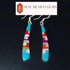 This is a pair of Zuni multi gem inlay earrings. They are set in sterling silver with sterling earring hooks.  -approx. 2" X 1/4" at the widest point -stamped sterling Check out the rest of our collection: https://www.etsy.com/shop/NewMexicoGems Dangle Inlay Earrings For Gifts, Southwestern Silver Earrings With Inlay, Dangle Earrings With Inlay For Gift, Inlay Dangle Earrings For Gift, Teardrop Inlay Earrings As Gift, Blue Inlay Earrings For Gifts, Sterling Silver Multi-stone Teardrop Earrings, Blue Sterling Silver Earrings With Inlay, Blue Inlay Earrings For Gift