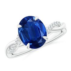 an oval blue sapphire and diamond ring in white gold with diamonds on the band,