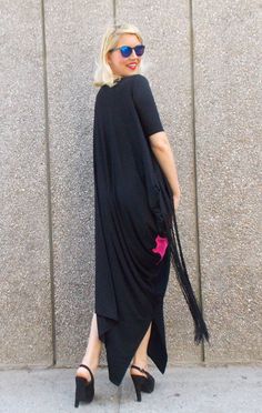 Women maxi dress with fuchsia inset and silk fringes. Very loose and playful kaftan, perfect both for parties and day wear. Great fabric, very soft viscose with a smooth feeling that easily gives that boho chic attitude. Material: 95% viscose, 5% elastane Care instructions: Wash at 30 degrees. The model in the picture is size S. Can be made in ALL SIZES. If you have any other specific requirements, do not hesitate to contact me! I DO NOT CHARGE EXTRA MONEY for custom made items. All you need to Festival Floor-length Maxi Dress With Tassels, Spring Maxi Dress With Fringe, Fringe Floor-length Maxi Dress, Long Maxi Dress With Tassels, Spring Maxi Kaftan With Tassels, Black Fringe Maxi Dress For Spring, Black Maxi Dress With Fringe For Spring, Spring Black Maxi Dress With Fringe, Floor-length Festival Dress With Tassels