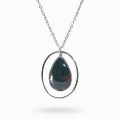 a necklace with a tear shaped pendant hanging from it's center, on a chain