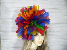 "Rainbow feather fascinator big and full about 10-12\" wide. Each one is a little different but just as fabulous! There is a clip and headband for you to choose which is best for you. Both will be included. Just open the clip and pull from the elastic and slide in the headband. Great for many events. Once you receive it be sure to give it a few good shakes to fluff up the feathers from the long journey in the box. Check out my other items in my shop https://www.etsy.com/shop/MsPurdy I ship many Multicolor Carnival Headband Fascinator, Multicolor Feathered Fascinator For Kentucky Derby, Multicolor Feather Fascinator For Kentucky Derby, Carnival Hat Fascinator With Feathers, Halloween Alice In Wonderland, Alice In Wonderland Hat, Rainbow Feather, Steampunk Top, Steampunk Top Hat