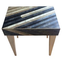 a wooden table with black and white stripes on it