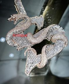 2.0 ct Diamond Dragon Pendant Iced Out Dragon Pendant Dragon Animal Pendant Dragon Faced Pendant Diamond Hip Hop Pendant Diamond Pendant ✥ O T H E R ∙ I N F O R M A T I O N ✥ ♦ Due to every item in our shop is made to order we are open for moderate customization on demand. Contact us prior to the order. ♦ Your item will be nicely packed to gift in elegant jewelry boxes. ♦ The jewelry Certificate will be sent separately if demanded prior to the order. Contact us for more details. ✥ T U R N ∙ A R O U N D ∙ T I M E ✥ ♦ Our turnaround time is about 6 days for the given design and finish or from 7 to 10 business days for custom-made designs. This can change during peak seasons. ✥ If you can't find the information you need or need some advice for your design, feel free to contact us. We are eage Snake-shaped Diamond Jewelry For Anniversary, Diamond Snake Shape Jewelry For Anniversary, Snake Shape Diamond Jewelry For Anniversary, Fine Jewelry Snake Shape With Diamond Accents, Fine Jewelry With Diamond Accents In Snake Shape, Silver Iced Out Diamond Necklace Fine Jewelry, Iced Out Silver Diamond Necklace Fine Jewelry, Silver Iced Out Pendant Necklace, Luxury Diamond Necklace With Sparkling Details