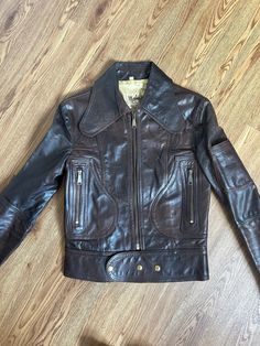 1960s / 70s Beagle collar leather jacket -- Musical Instruments inspired 🌈 This jacket is in great vintage condition, 100% leather and has the most gorgeous details, look that back. Circa 1973-4. Has two pockets and one on the arm. Women's but can definitely be worn unisex. Hard to come across jackets like these in pristine condition. Small bit of damage on the left shoulder, see last photo and can see in the others. Measurements follow shoulder 16" bust 15 waist 17 length 22 arm width 6cm Retro Fitted Biker Jacket For Fall, Fitted Retro Leather Jacket, Retro Brown Biker Jacket With Pockets, Vintage Brown Retro Leather Jacket For Winter, Retro Leather Jacket For Fall, Retro Fitted Leather Jacket For Fall, Fitted Retro Leather Jacket For Fall, Retro Leather Biker Jacket With Pockets, Retro Leather Biker Jacket For Fall