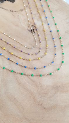 This stainless steel women's necklace consists of a fine rosary chain with epoxy resin enameled beads. 5 colors to choose from: White, Lilac, Yellow, Blue or Green An absolutely I.N.C.O.N.T.O.U.R.N.A.B.L.E necklace to adopt urgently! Wear the jewelry that suits you with Elle&Co Bijoux https://elleandcobijoux.etsy.com FEATURES : Entirely handmade jewelry. Gold-colored stainless steel necklace, hypoallergenic. Total length of the necklace: approximately 42 cm including 4cm of extension chain (it is possible to adjust the length of the chain at your request). MANUFACTURING and CUSTOMIZATION: Each piece of jewelry is made by me in my Nîmes workshop, using carefully selected materials. These creations are produced in limited series and can be the subject of a customization request. Do not hesit Trendy Enamel Necklace With Adjustable Chain, Elegant Enamel Necklace With Adjustable Chain, Blue Stainless Steel Necklace With Adjustable Chain, Gold Enamel Necklace With Cable Chain, Rosary Chain Necklace, Blue Kyanite Gemstone Necklace, Enamel Beads, Rosary Chain, Pretty Gift