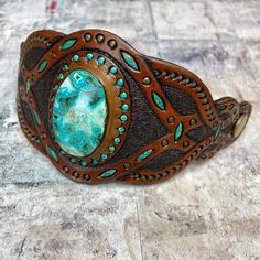 Bohemian Turquoise Leather Bracelet As Gift, Bohemian Jewelry With Patina As A Gift, Rustic Green Adjustable Jewelry, Southwestern Hand Tooled Jewelry For Festivals, Southwestern Patina Jewelry As A Gift, Southwestern Jewelry With Patina As Gift, Southwestern Hand Tooled Leather Bracelets, Southwestern Patina Jewelry Gift, Handmade Southwestern Brown Jewelry