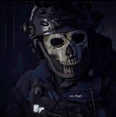 a skull wearing a helmet and goggles in the dark