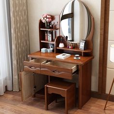 a dressing table with a mirror and stool