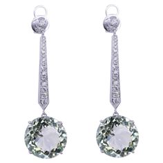 Green Amethyst Brilliant Cut Round Prasiolite Diamond Drop Line Unique Statement Classic Timeless 18K White Gold Dangle Earrings 18 Karat White Gold Genuine Green Amethyst/Prasiolites & Diamonds 16.71 CT Green Amethyst Gemstones 0.53 CTW Diamonds Beautiful light green color - almost transparent in brilliance with hints of slight light green hues of forests, fields & mints. Some have commented that these stones remind them of the Mediterranean Sea of Greece & Balkan coasts. Extremely aqua teal green. Stunning pair of earrings crafted in white gold for a classic, timeless look & ready-to-wear for any occasion, especially for evening & formal wear. Gold Dangle Earrings, Green Hues, White Gold Earrings, Earring Crafts, Diamond Drops, Mediterranean Sea, Green Amethyst, Gold Earrings Dangle, Amethyst Gemstone