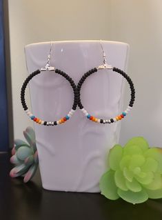 Handmade Colorful Czec glass seed bead earrings Southwestern Style Hoop Earrings Hoop size is 1 1/2 inches in diameter  Silver plated earwire Southwestern Beaded Round Earrings, Southwestern Style Beaded Round Earrings, Southwestern Round Beaded Earrings, Nickel-free Hoop Earrings With Heishi Beads, Adjustable Colorful Beaded Round Earrings, Nickel-free Multicolor Heishi Beads Jewelry, Southwestern Style Beaded Dangle Hoop Earrings, Adjustable Southwestern Beaded Earrings With Ear Wire, Colorful Southwestern Beaded Earrings